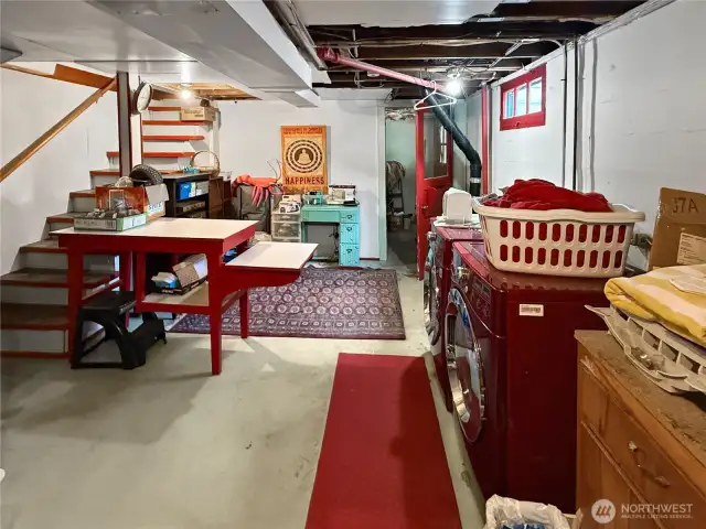 This spacious basement area is more than just laundry — it’s a flexible zone for projects, hobbies, storage, and creativity. With easy access to the backyard and stairs leading up to the main level, it’s both practical and connected. Whether you’re folding clothes, refinishing furniture, or storing your seasonal gear, this hardworking space has your back.