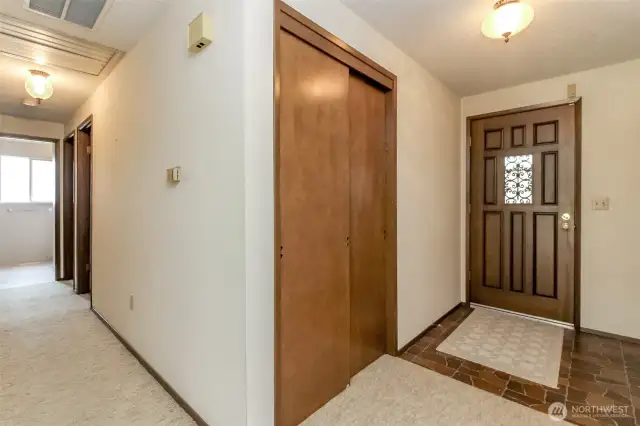 Large coat closet and notice hallway vent for attic fan that cools the home!