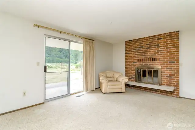 Sliding glass doors off of family room lead to patio! Wood stove heats home!