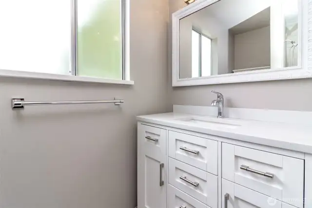 Main bathroom by bedrooms, 1/2 bath is back by office.