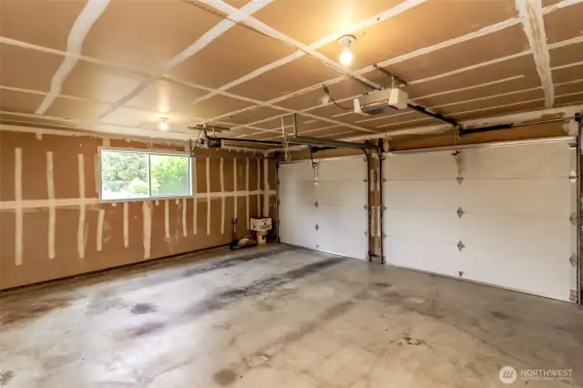 Two car garage with automatic garage door openers.