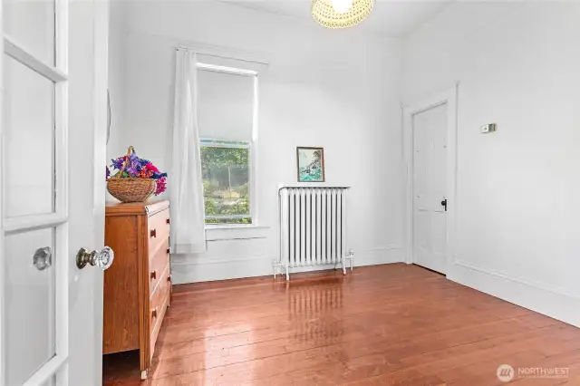 One of 2 bedrooms. Extremely high vaulted ceilings which are gorgeous. You could lower the ceilings to create more space in the attic and have a finished second story.