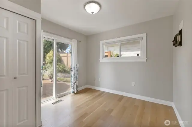 2nd main floor bedroom with access to the backyard deck. You'll find plenty of outlets in this room and  throughout the home including some with USB ports.