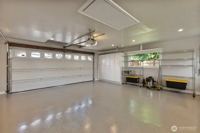 Can you use the word stunning for a garage?  I think you can for this one. Newly epoxied floors and abundant storage cabinets. A pull down ladder for attic storage access and additional attic access closer to garage door. Metal shelves and all cabinets included.