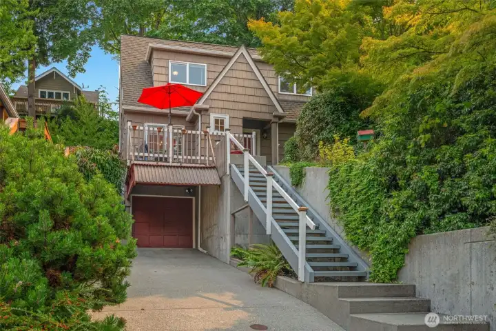Classic Appeal on a Leafy, Serene Queen Anne Boulevard! Wonderful OPPORTUNITY to live in one of Seattle's top neighborhoods! A very quiet location yet very convenient to Dwtn, S. Lk Union, & north to Ballard. Wonderfully walkable to McGraw & 10th caffes & near everything on coveted QA Hill. 2 roomy beds upstairs, circular flr plan w/a liv & din room. 2 decks to enjoy: endless, pink-skyed sunsets from front deck conveniently located thru slider doors + a private, cooling back deck refuge. 4 off-street pkg spots: an attached garage + carport + room for 2 more cars off-street on long driveway. Handy lower level w/so many options: finish as a home theater or office or use now as workout space, shop, yoga/art/music studio, storage, or a combo.