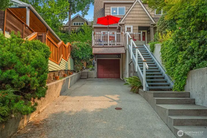 4 off-street parking spots: attached garage + carport + room for 2 more cars on this long driveway.