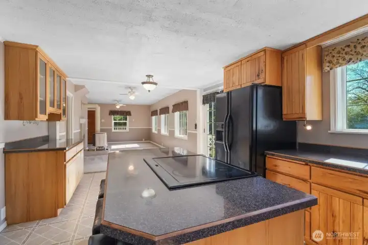 Kitchen with island/eating bar, laundry to the left