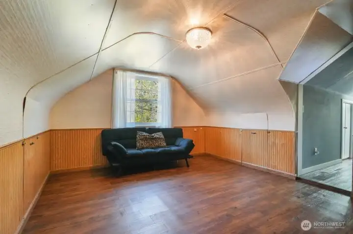 Office area off primary bedroom, hallway leading to primary on right