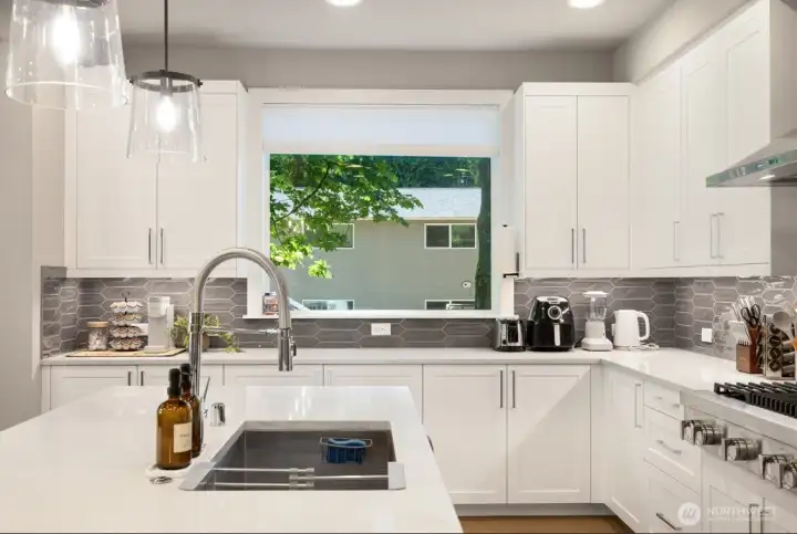 functional island with sink and dishwasher