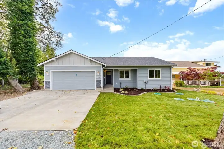 This beautifully updated single-level home offers fresh curb appeal, a crisp modern exterior, and an easy-living layout in a welcoming neighborhood setting.