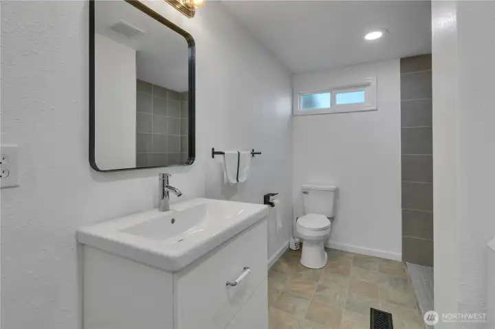 Bathroom with Large shower no step.
