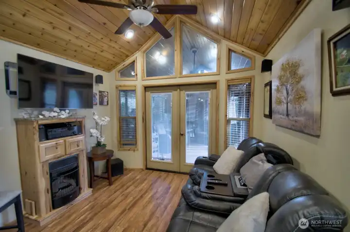 LIVING ROOM WITH CABINET/FIREPLACE AND TV