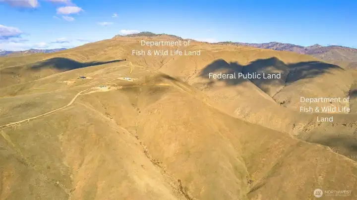 Backed by expansive federal land creating a natural buffer and open space