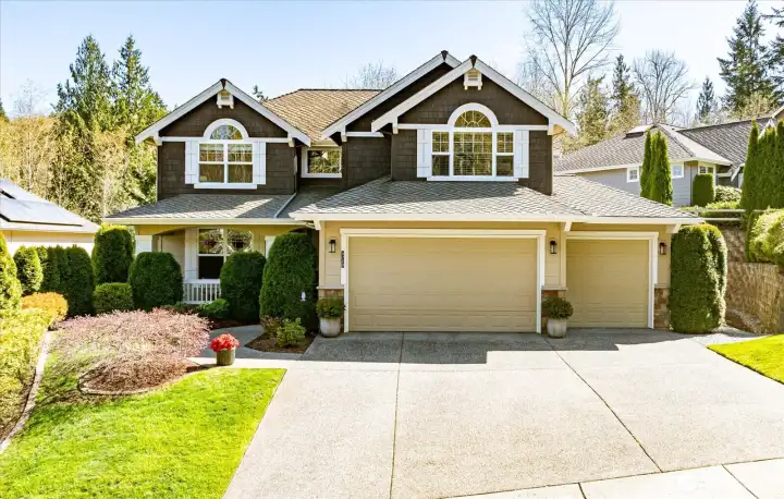 Welcoming curb appeal with mature landscaping and a peaceful neighborhood setting.