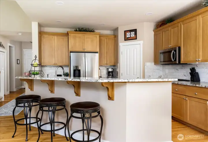 Kitchen refresh in 2023/2024 - new granite countertops, backsplash, sink & faucet. Upgraded appliances.