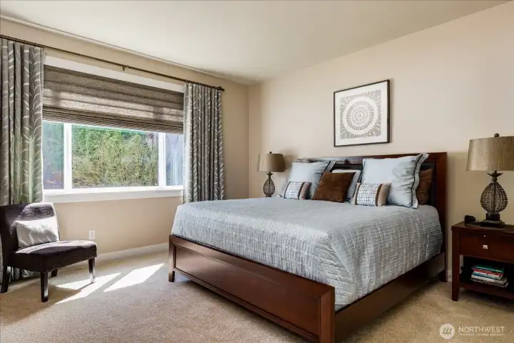 Spacious main level primary bedroom with full bath & walk in closet