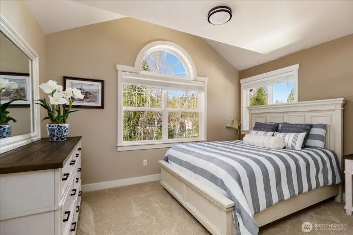 Spacious bedroom on upper level faces west