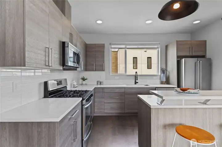Open kitchen with modern finishes and storage