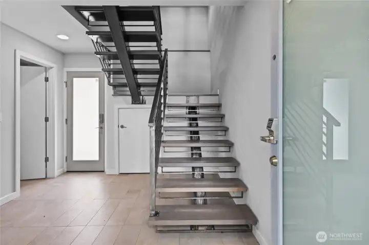 Custom Stainless Steel Staircase connecting the different floors.