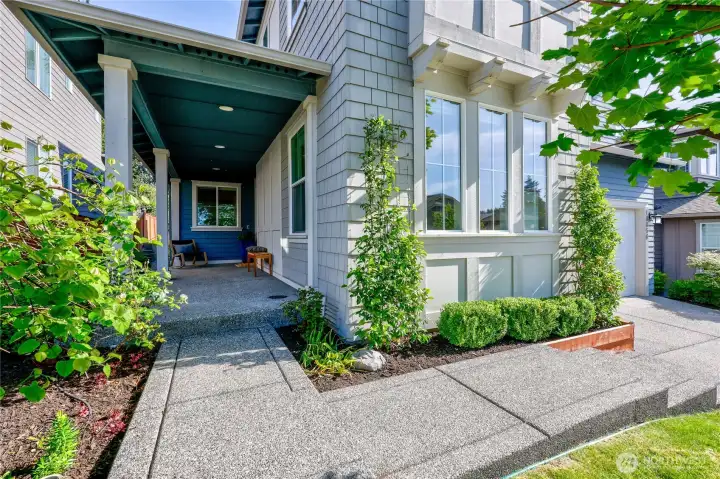 The front yard floods with sunlight! Plenty of space on the patio for lounge chairs and relaxing. The front yard floods with sunlight! Plenty of space on the patio for lounge chairs and relaxing.