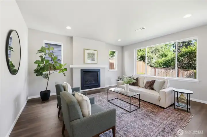 With high ceilings and a cozy gas fireplace, this living room offers the perfect blend of comfort and elegance. With high ceilings and a cozy gas fireplace, this living room offers the perfect blend of comfort and elegance.