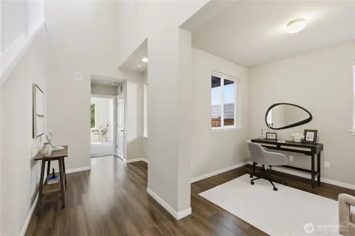 Just off the front entry, you’ll find a versatile bedroom and open office/den space, accompanied by a convenient ¾ bath—ideal for guests, remote work, or multigenerational living. Just off the front entry, you’ll find a versatile bedroom and open office/den space, accompanied by a convenient ¾ bath—ideal for guests, remote work, or multigenerational living.