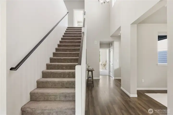 The staircase leads to the upper floor bedrooms, the large loft / family room, and the laundry room. The staircase leads to the upper floor bedrooms, the large loft / family room, and the laundry room.