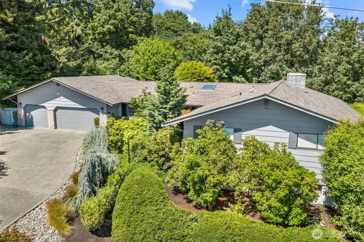 Tucked into a quiet road, this home enjoys a huge circular driveway