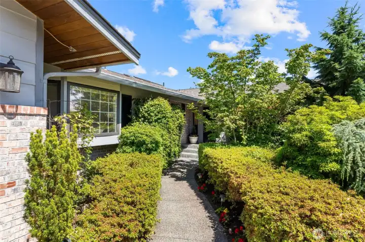 Mature landscaping greets you