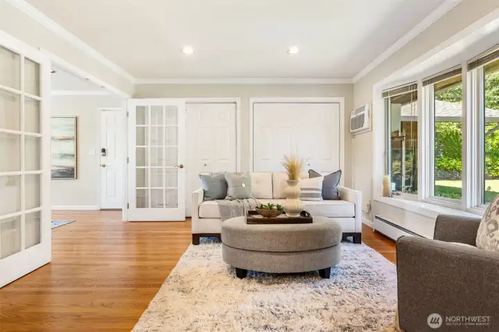 Enter to the great room of the kitchen with french doors that lead to the den