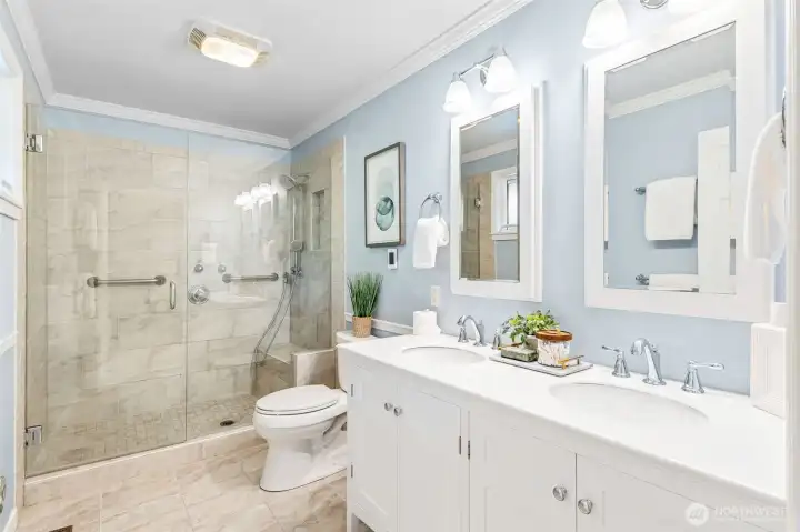 Gorgeous primary bath is fully updated and enjoys a good sized walk in shower