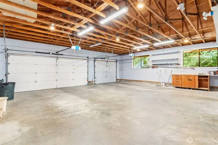 Huge three car garage with its own shop