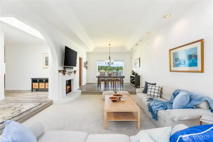 Entry living room and dining room with fireplace in the living room