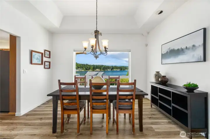 Another view of the Dining room from the living room.  New vynil tile flooring throughout dining, kitchen, 3rd bedroom/office, family room.