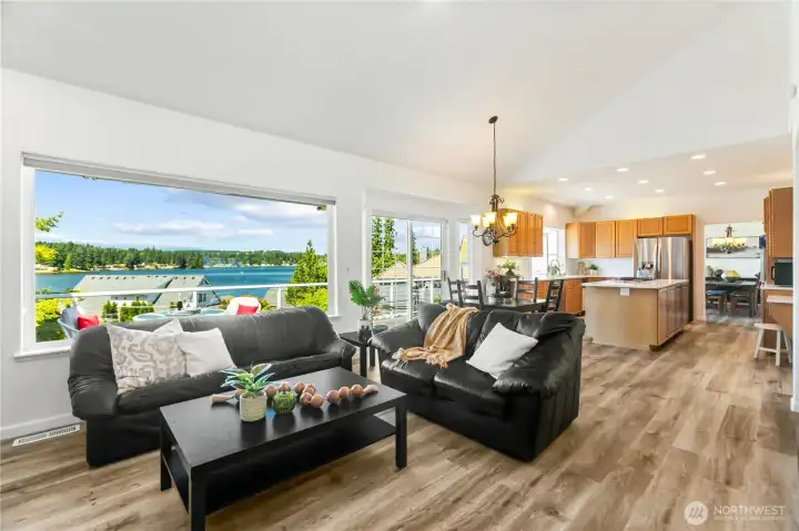 View of Kitsap Lake from the family room.  Sliding door goes to the huge treck deck off the kitchen eating area.