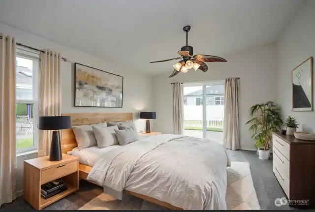 * Virtual Staged * The primary suite includes a brand-new sliding glass door that opens directly to the patio, providing easy access to outdoor relaxation.