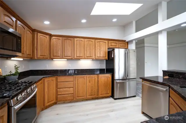 A spacious kitchen, perfect for the chef of the home to create culinary delights.  Brand new flooring  just installed.