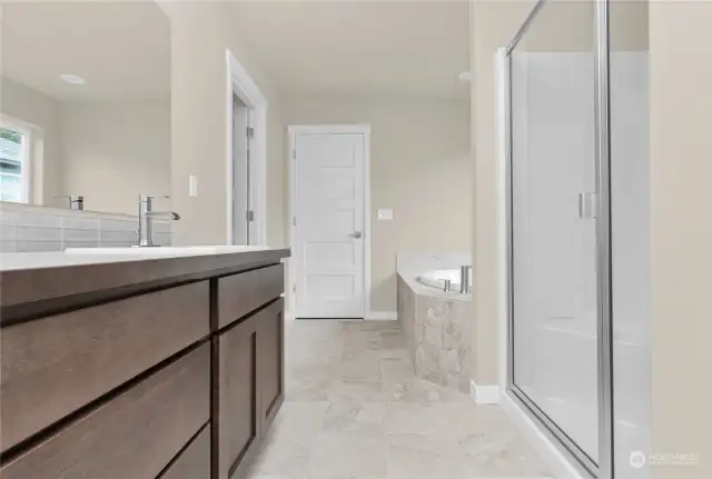 Similar home, not actual. Primary bed bathroom.