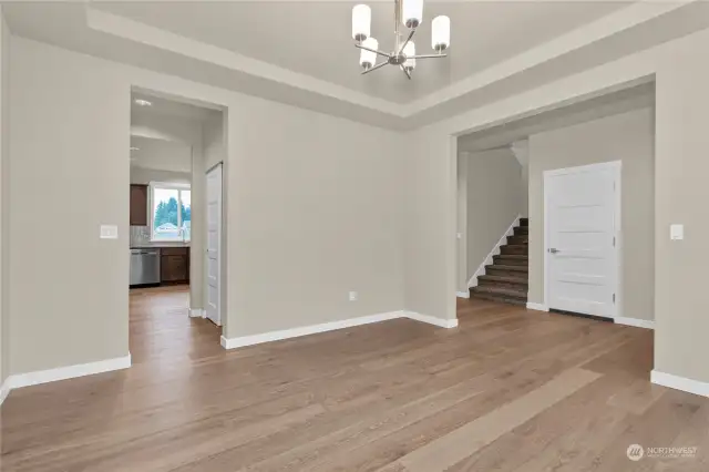 Similar home, not actual. Hardwood flooring in entry, kitchen and dining.