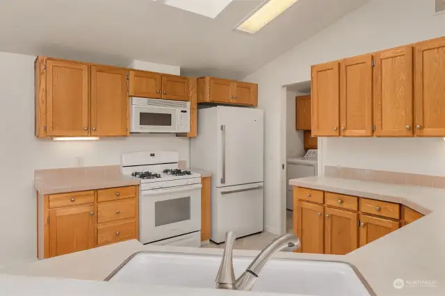 Tons of storage and counter space, as well as a gas range. All appliances remain with the home, including the garage refrigerator/freezer.