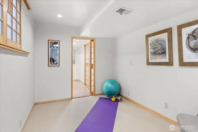 Lower level bedroom with attached bath.