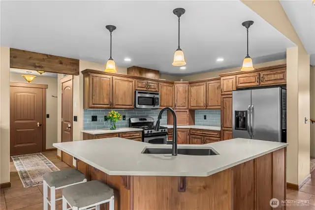 Spacious kitchen with ample storage and convenient walk-in pantry nearby.