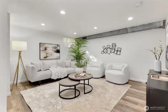 The downstairs living room. Nice sized space here for gatherings or watching tv.