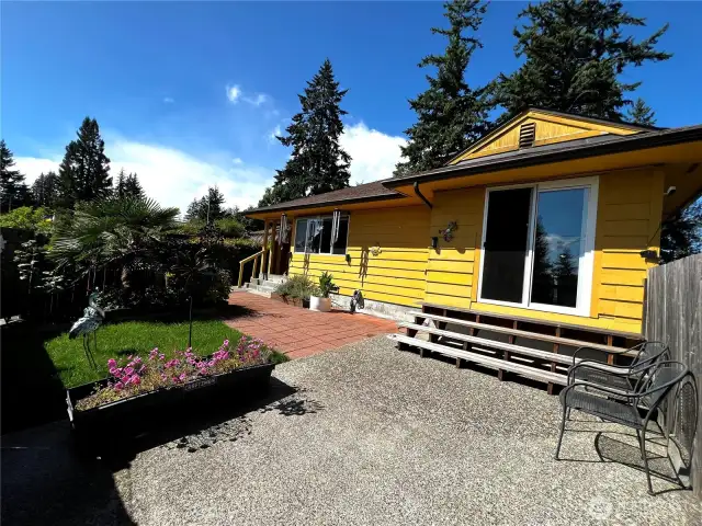 Sliding Glass Door Leads From Dining to Patio in Front Yard