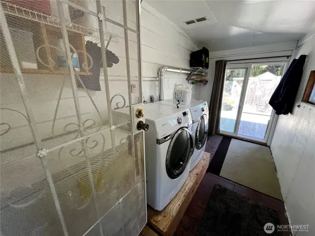 Laundry Area on Main Floor. Glass Door to Fully Fenced Backyard