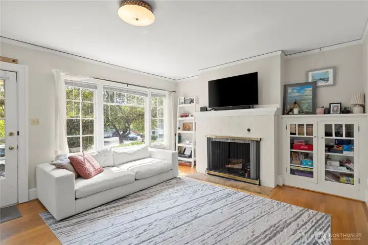 Living room with hardwood floors and built-ins