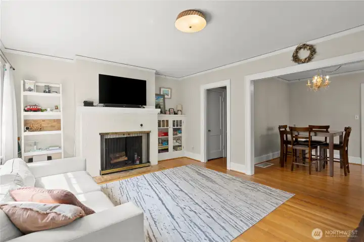 Light filled living room with wood burning fireplace