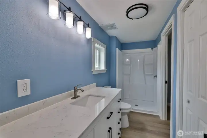 Another closet, oversized vanity and shower