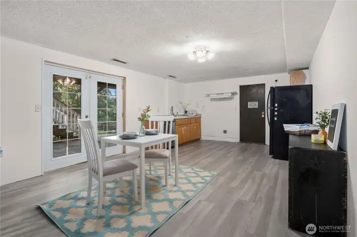 This open lower-level layout includes convenient access to the attached garage and the adjacent recreation room. The flexible design makes it ideal for multigenerational living, a private guest suite, or a separate workspace—balancing connection and independence within the home.
