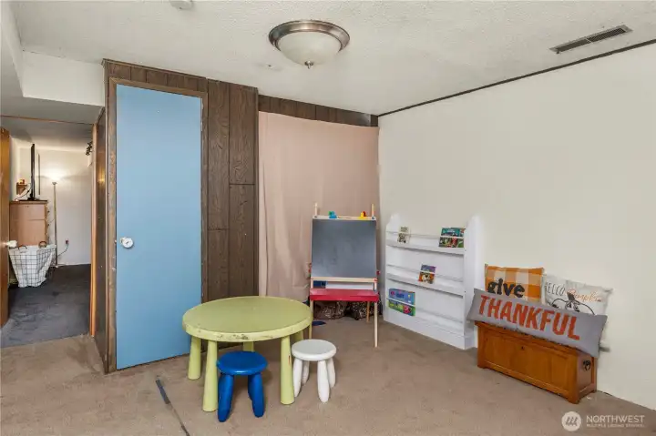 This versatile lower-level bonus space connects to the bedroom and kitchenette, creating a flexible layout ideal for extended living or multi-generational needs. Whether used as a playroom, gym, or hobby area, it provides endless options for how you live and gather.